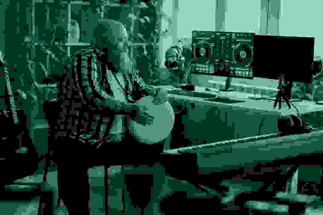 Musician performing energetically on stage, highlighting artist branding services Musician performing energetically on stage, highlighting artist branding services