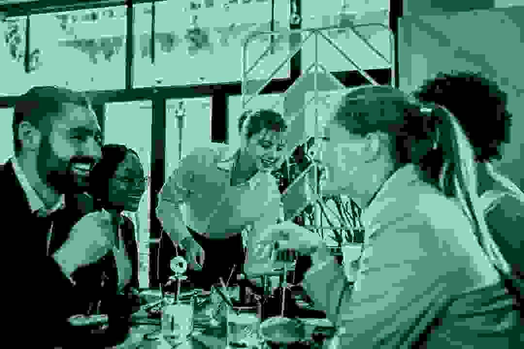 Restaurant staff preparing food and greeting customers, showcasing hospitality business services Restaurant staff preparing food and greeting customers, showcasing hospitality business services