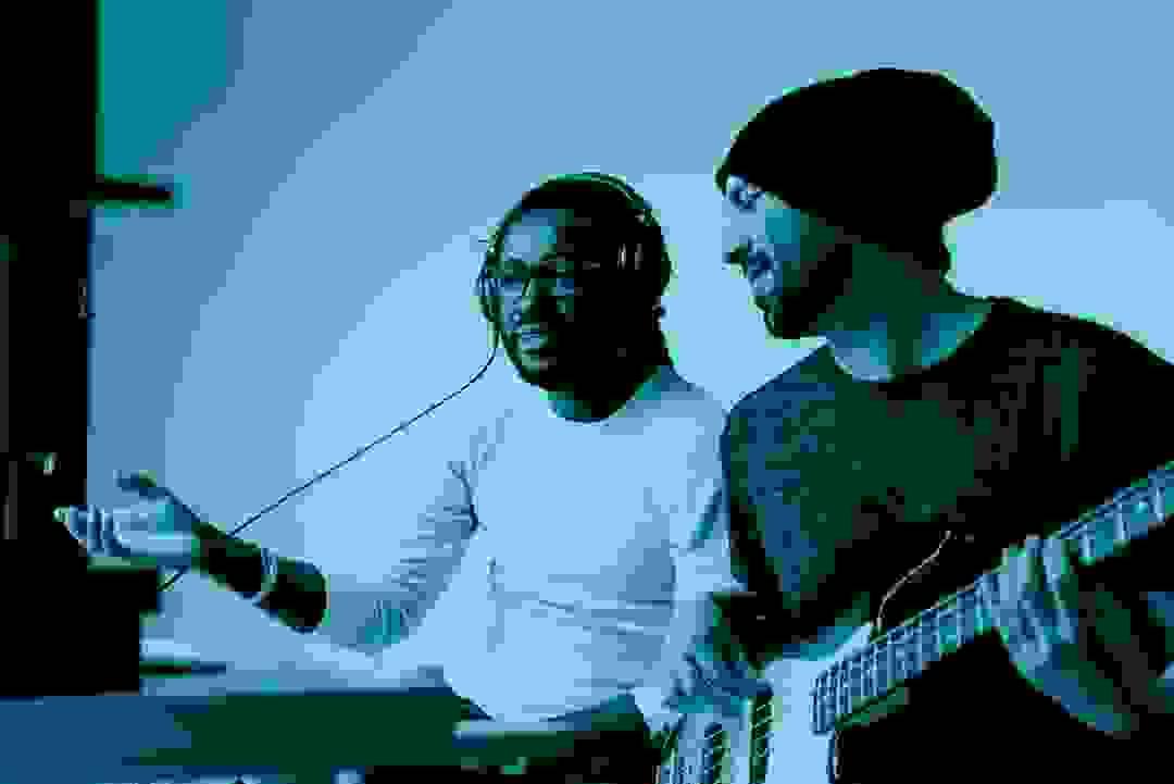 Team planning artist promotional strategies in a collaborative meeting Team planning artist promotional strategies in a collaborative meeting