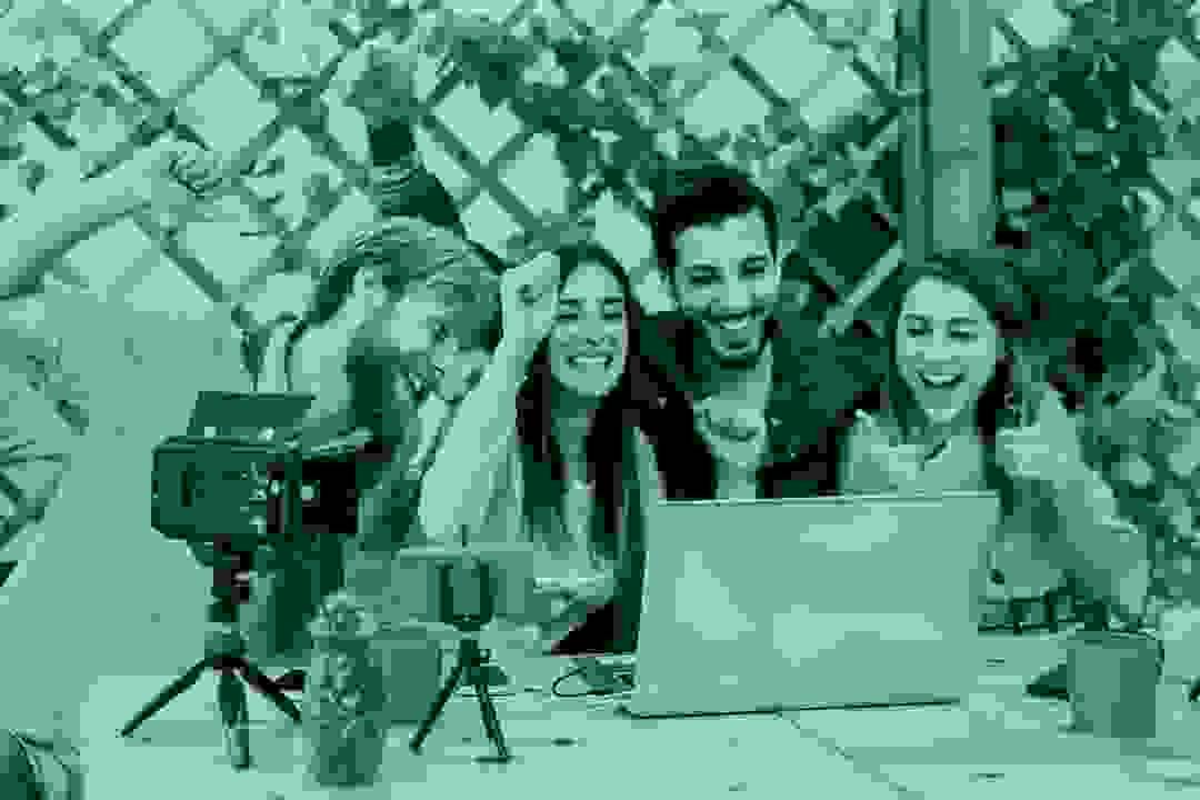 Influencer creating digital content with smartphone and camera gear Influencer creating digital content with smartphone and camera gear