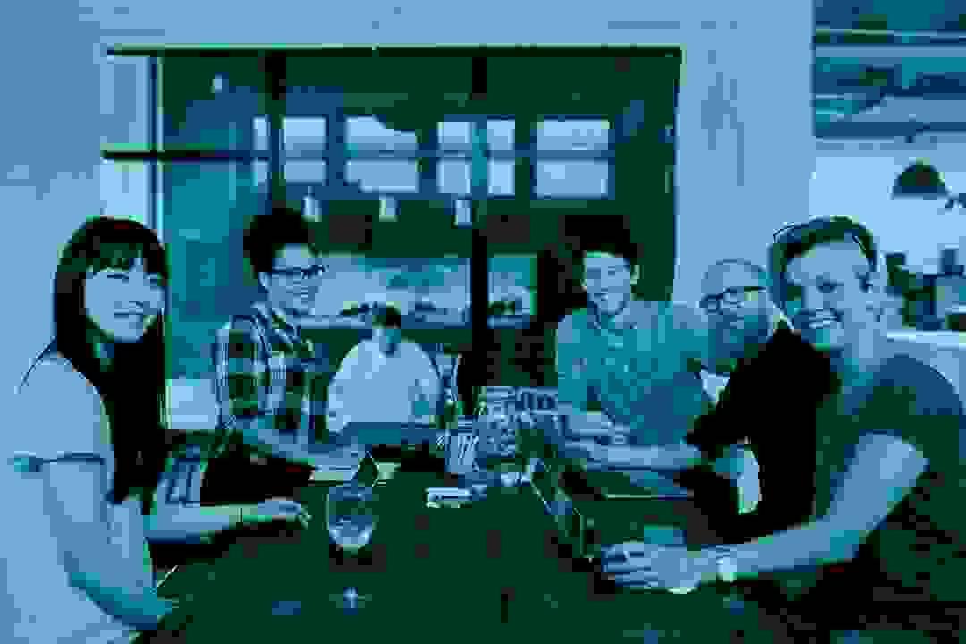 Startup team collaborating at laptops in a modern office, representing tech and SaaS companies Startup team collaborating at laptops in a modern office, representing tech and SaaS companies