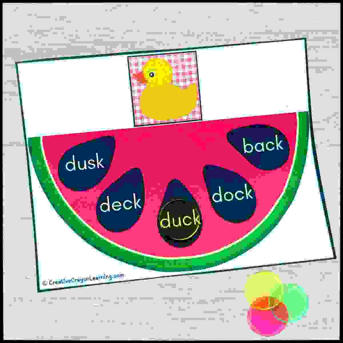 Watermelon-themed summer literacy center for kindergarten and first grade with CVC and blend/digraph word matching using bingo chips.