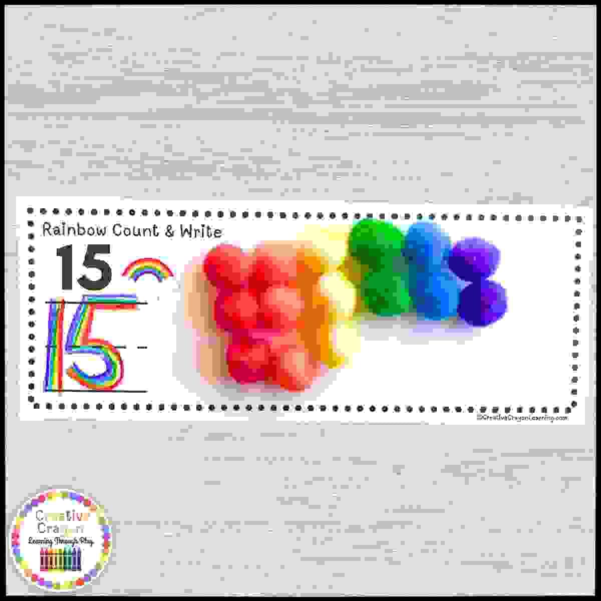 Counting and number writing math center for kindergarten with rainbow erasers and themed cards.