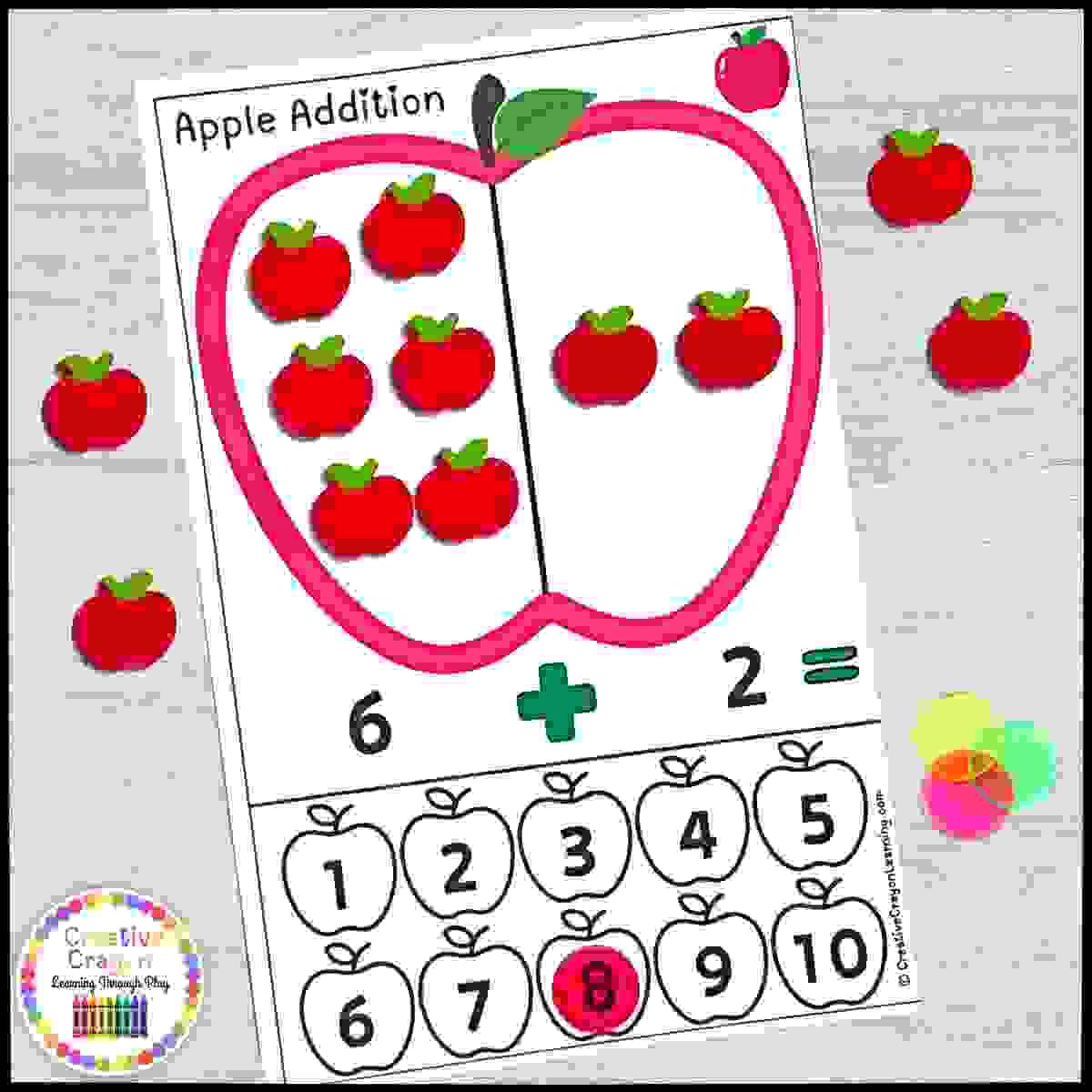Apple-themed hands-on addition math center for kindergarten with apple erasers and counting practice to 10.