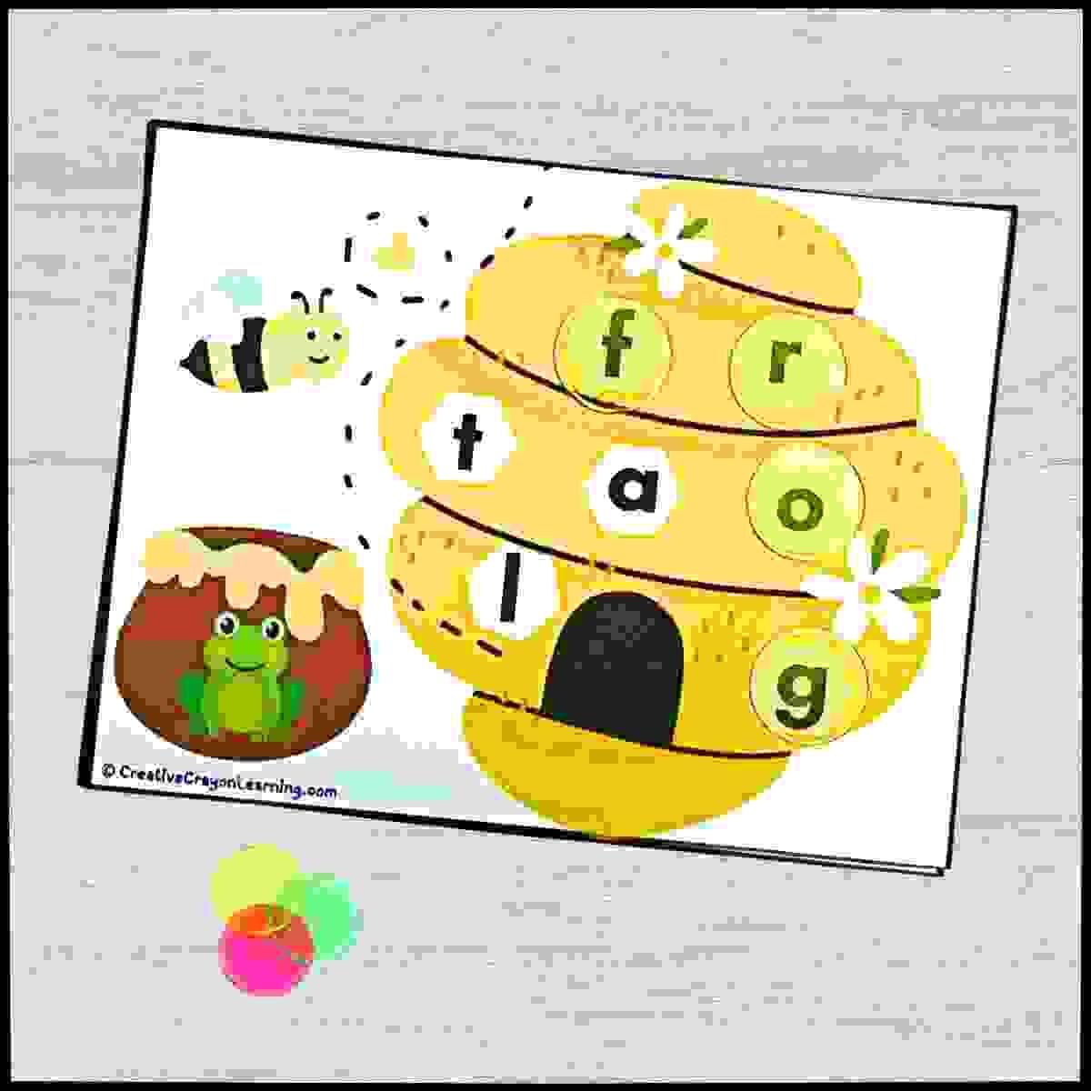 Beehive Spelling Buzz printable CVC activity for kindergarten with honey jar picture and letter matching.