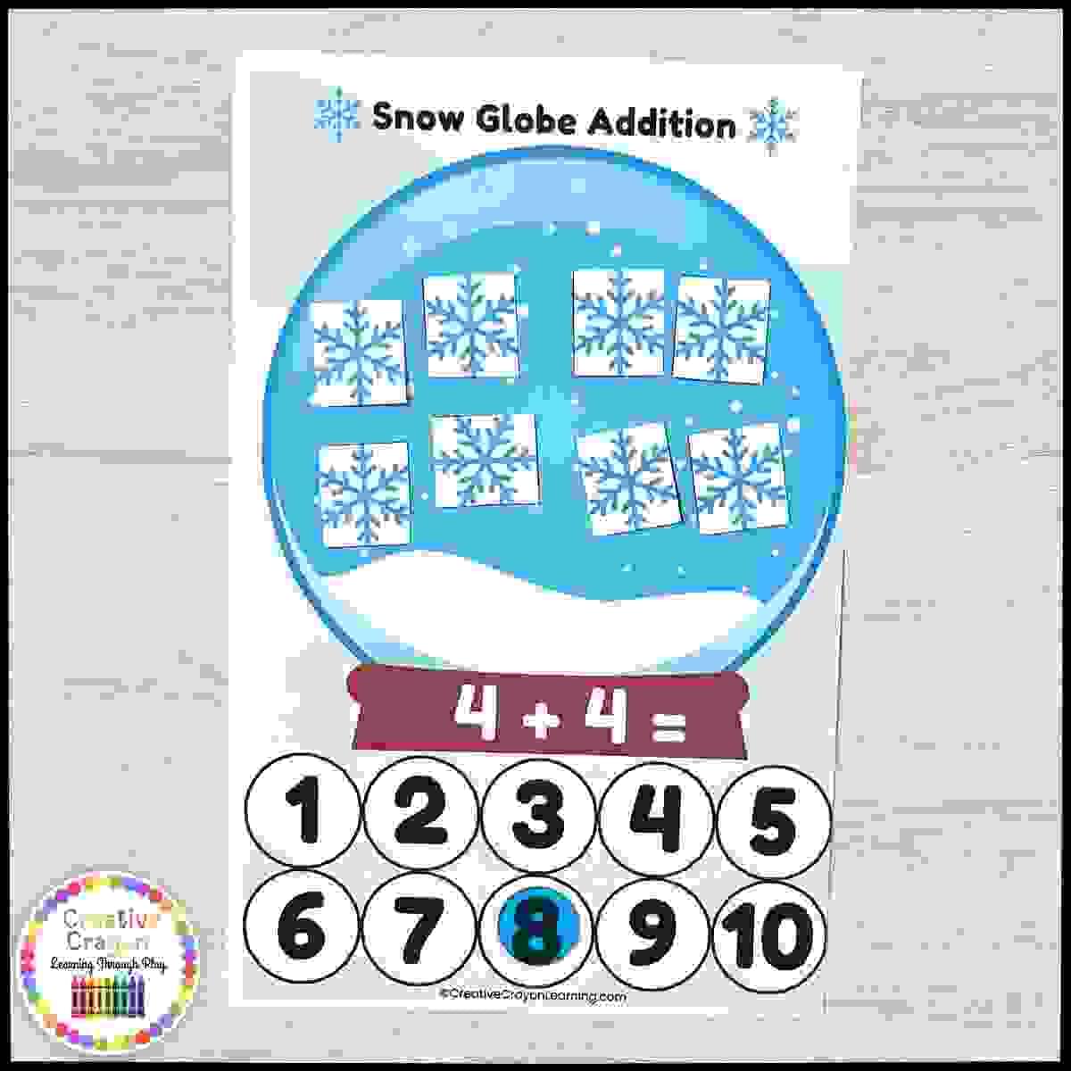 Kindergarten addition center with snow globe cards and snowflake counting manipulatives