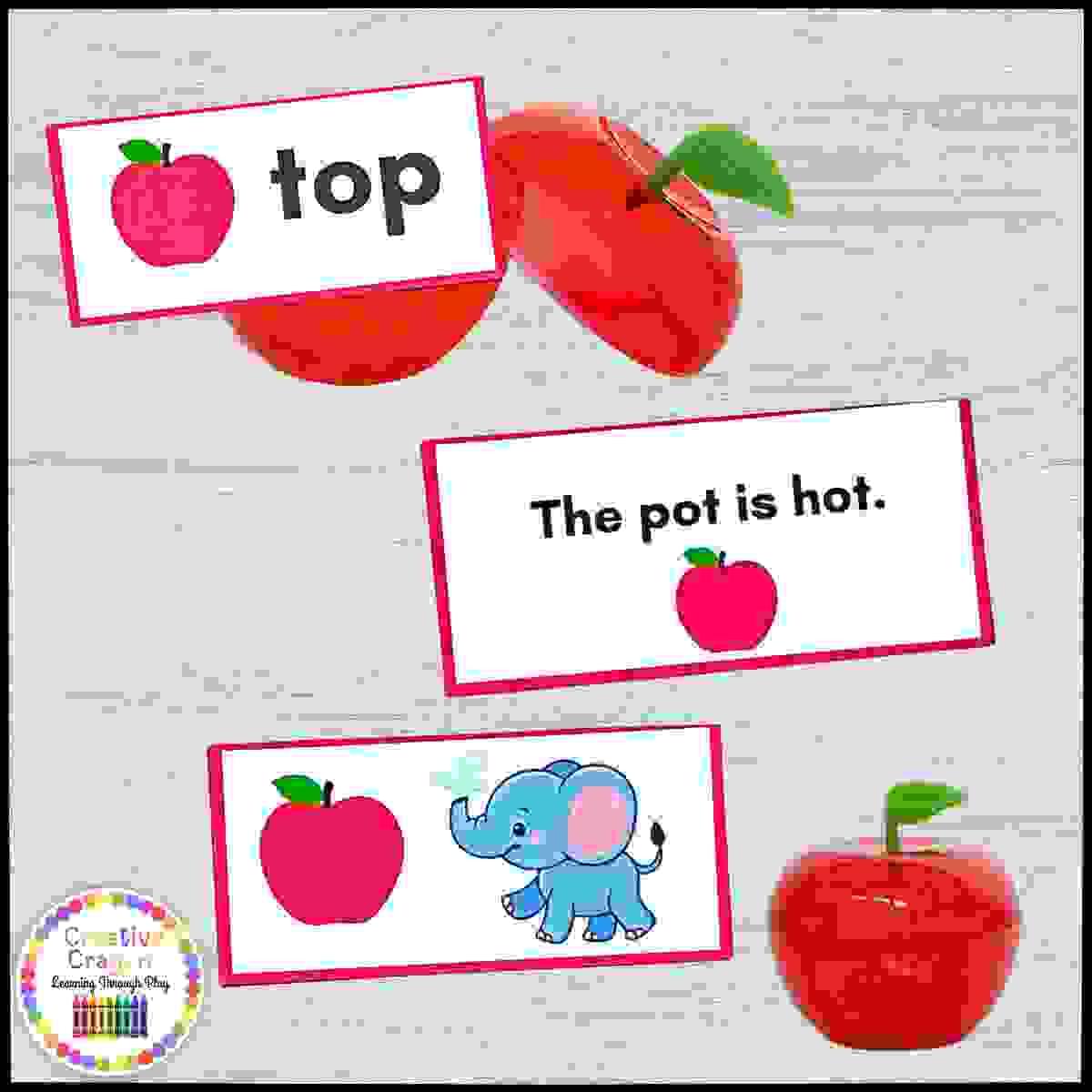 Hands-on CVC word and sentence building activity strips with plastic apples and matching word strips for kindergarten and Prek.