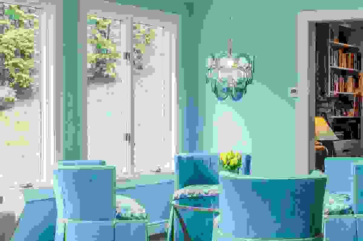 A place for morning coffee and evening relaxing beautiful matching floor and trim color with white railing and black handrail wrap around porch in Roanoke 