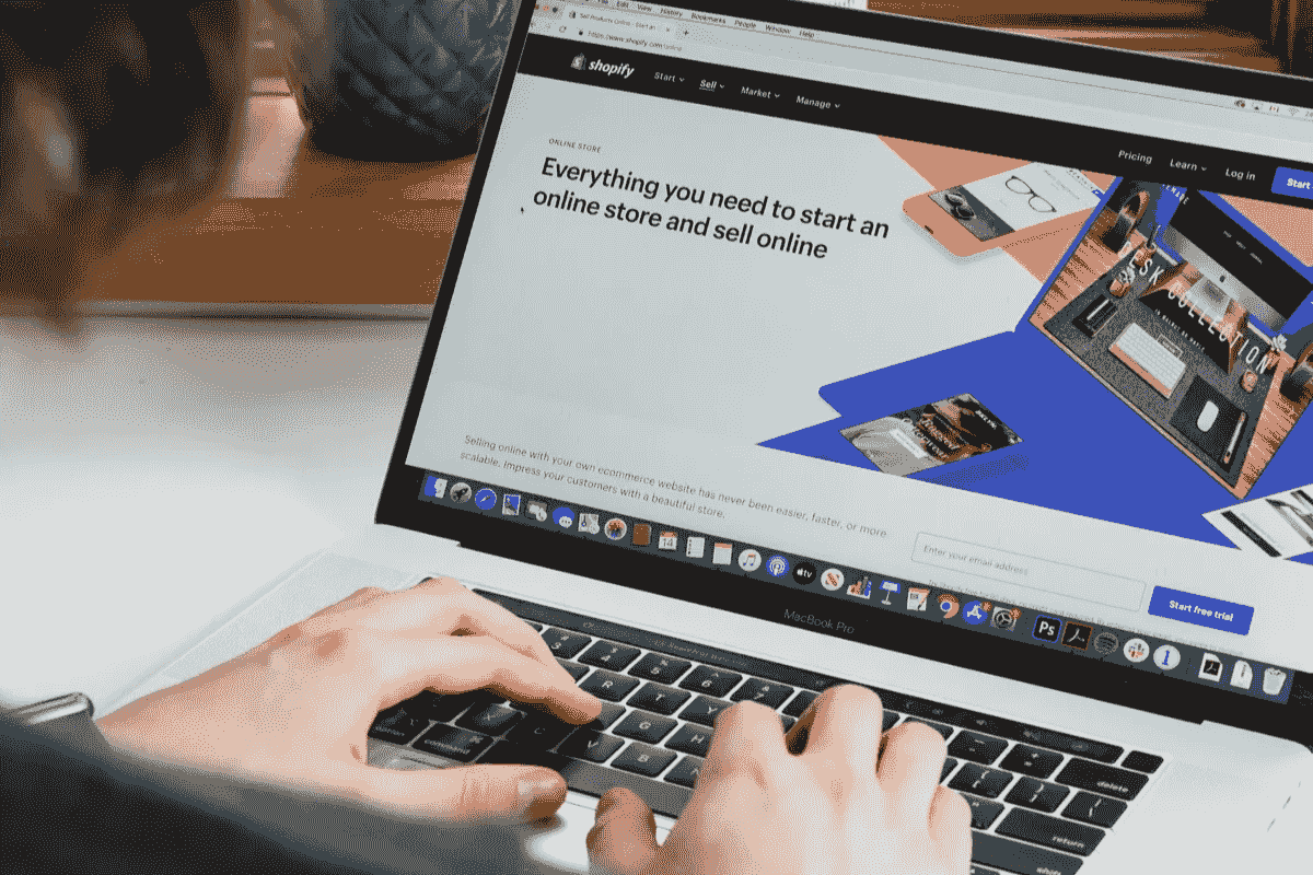 Person using a laptop for online commerce Person using a laptop for online commerce