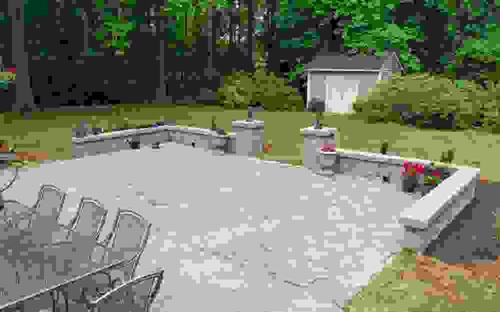 backyard stamped concrete patio addition with stone wall matching existing flatwork backyard stamped concrete patio addition with stone wall matching existing flatwork