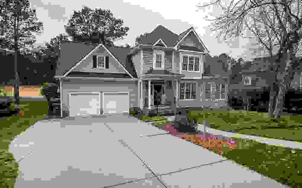 Newly completed driveway leading to nice home with two door garage Newly completed driveway leading to nice home with two door garage