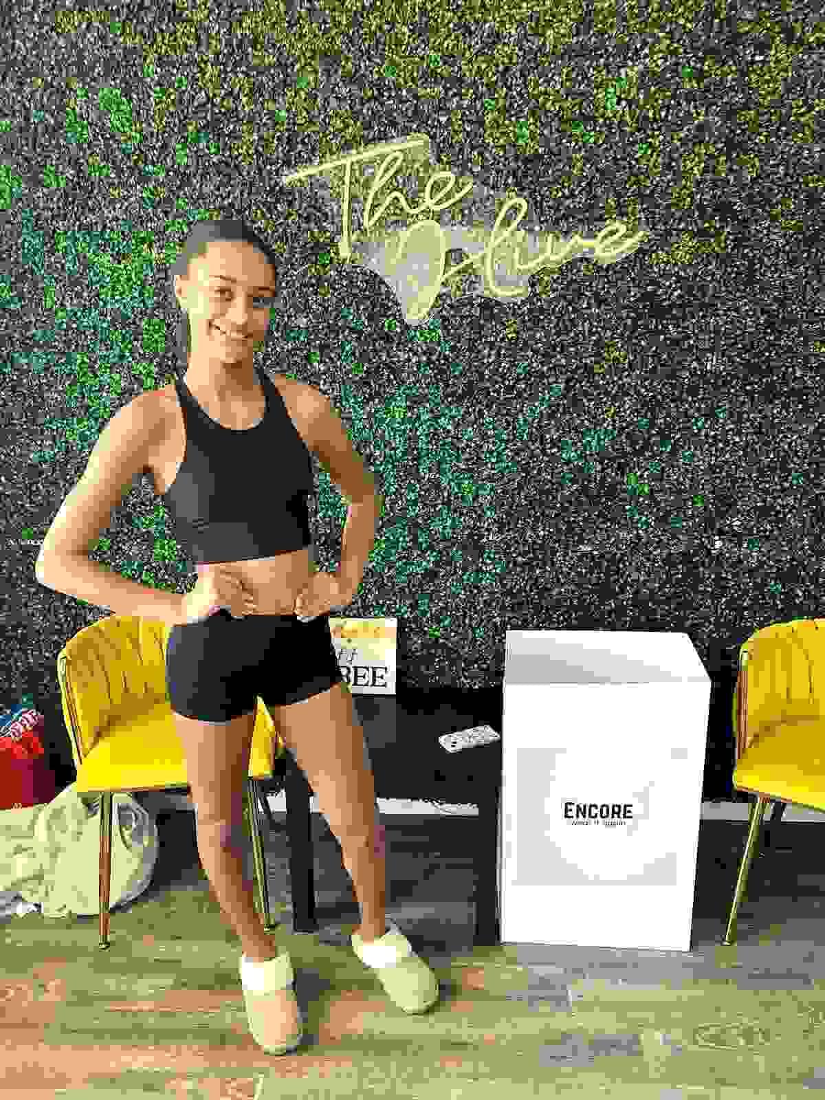At Encore, we believe in the power of community and sharing. Our initiative not only provides gently used dancewear to those in need but also promotes sustainability by reducing waste. Every donation helps a dancer continue their passion without the financial burden of new gear. Community Impact What We Do What is Encore?
Encore is a community service initiative started by June Ella Hyams when she was in the 6th grade.  Beautifully designed donation boxes are housed at dance studios throughout the Charleston, South Carolina area.  Lightly used or new dancewear, athletic wear, and shoes are donated to the boxes, and once the box is near full, we collect, clean, and ship the items to those in need.

How did Encore begin?
June Ella noticed that she was growing quickly out of her new dancewear and her mother noticed she had even outgrown some dancewear that still had tags on them before she got the chance to wear them.  This became the idea of sharing these clothes with other dancers.  Dancewear can be expensive, so this program helps to ease the financial burden for growing dancers as well as putting the dancewear back into good use for their own "encore".