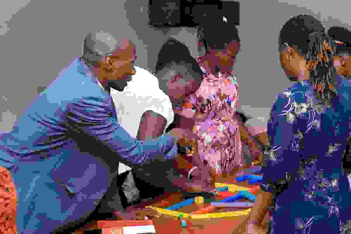 Conference participants interacting with the play-based model of learning.