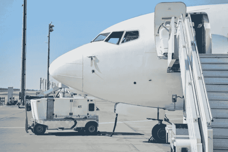 aircraft ground power unit powering airplane on tarmac