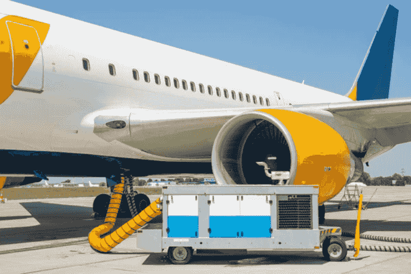 aircraft ground power unit powering airplane on tarmac