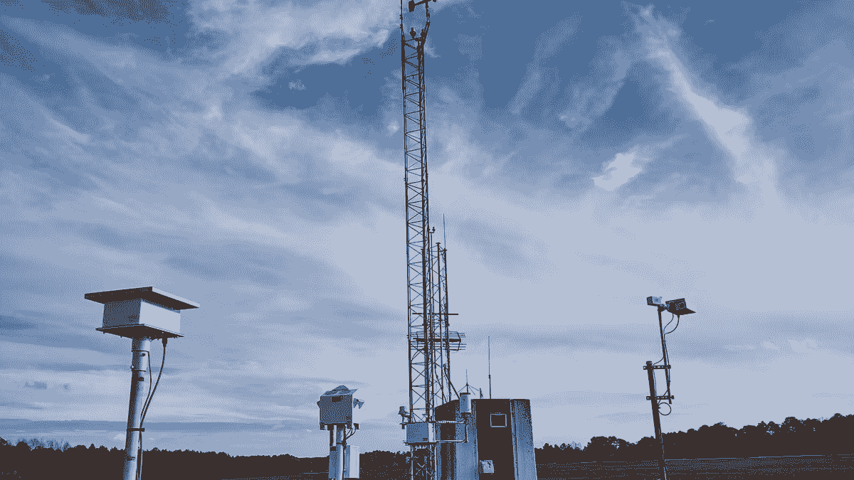 Airport weather observation station with radar and sensor equipment.