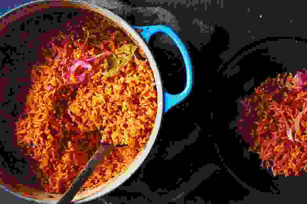 West African Jollof Rice Variations and Cooking Competi...