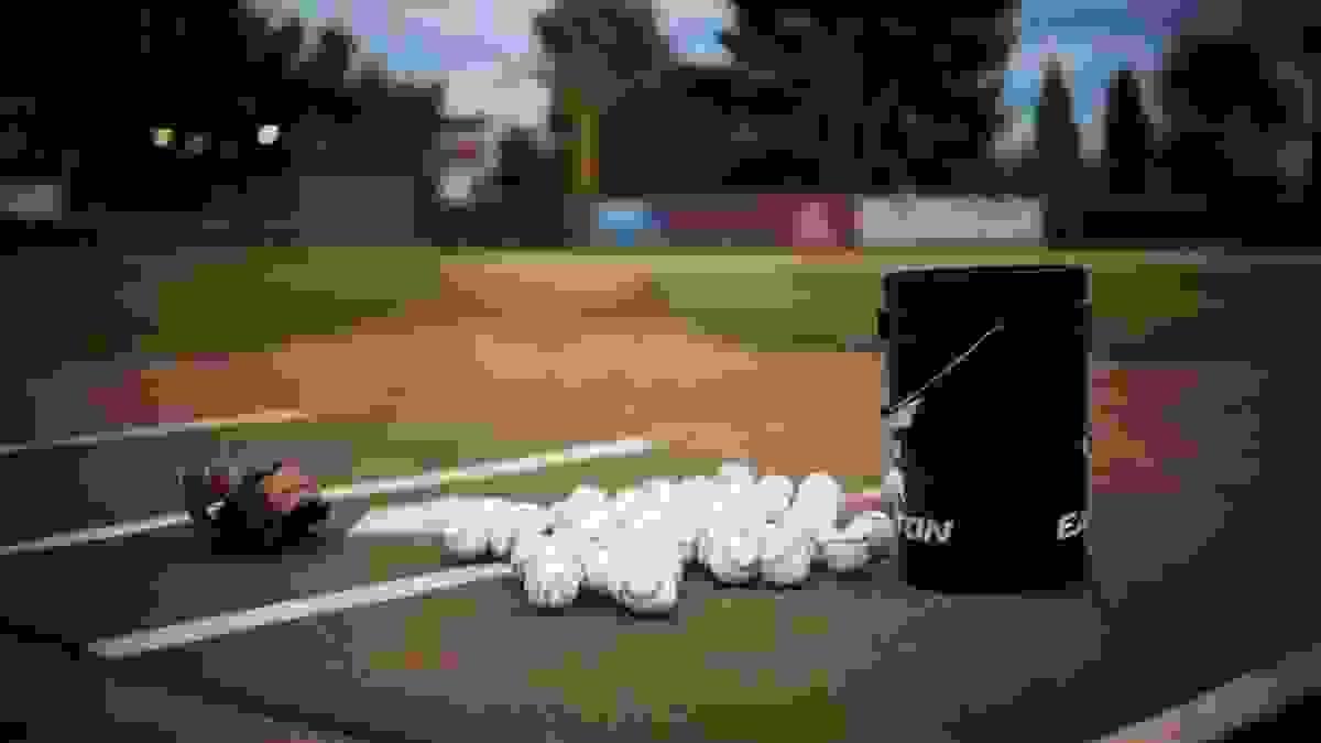 A bucket of baseballs ready for practice. A bucket of baseballs ready for practice.