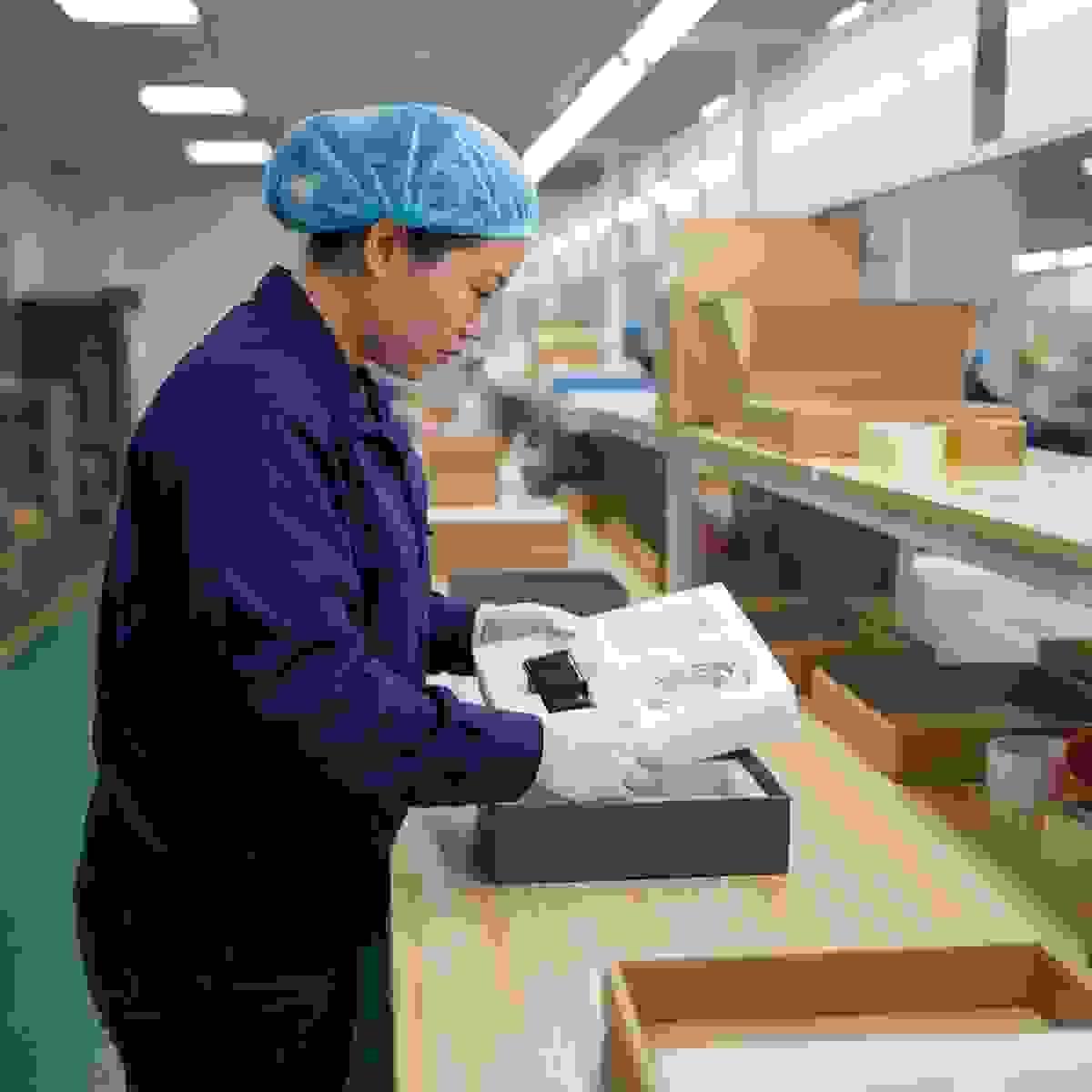 Chinese packaging factory assembly table with foam insert (EPE/PU) protecting electronics accessories. Chinese packaging factory assembly table with foam insert (EPE/PU) protecting electronics accessories.