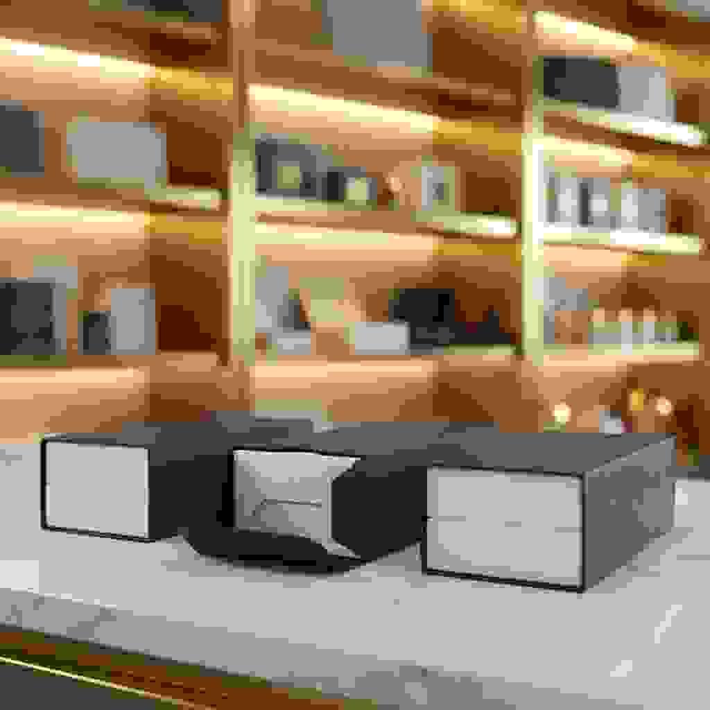 Tuck-end packaging sleeves with locking flaps, shown on rigid boxes with one sleeve end revealing the tuck structure. Tuck-end packaging sleeves with locking flaps, shown on rigid boxes with one sleeve end revealing the tuck structure.