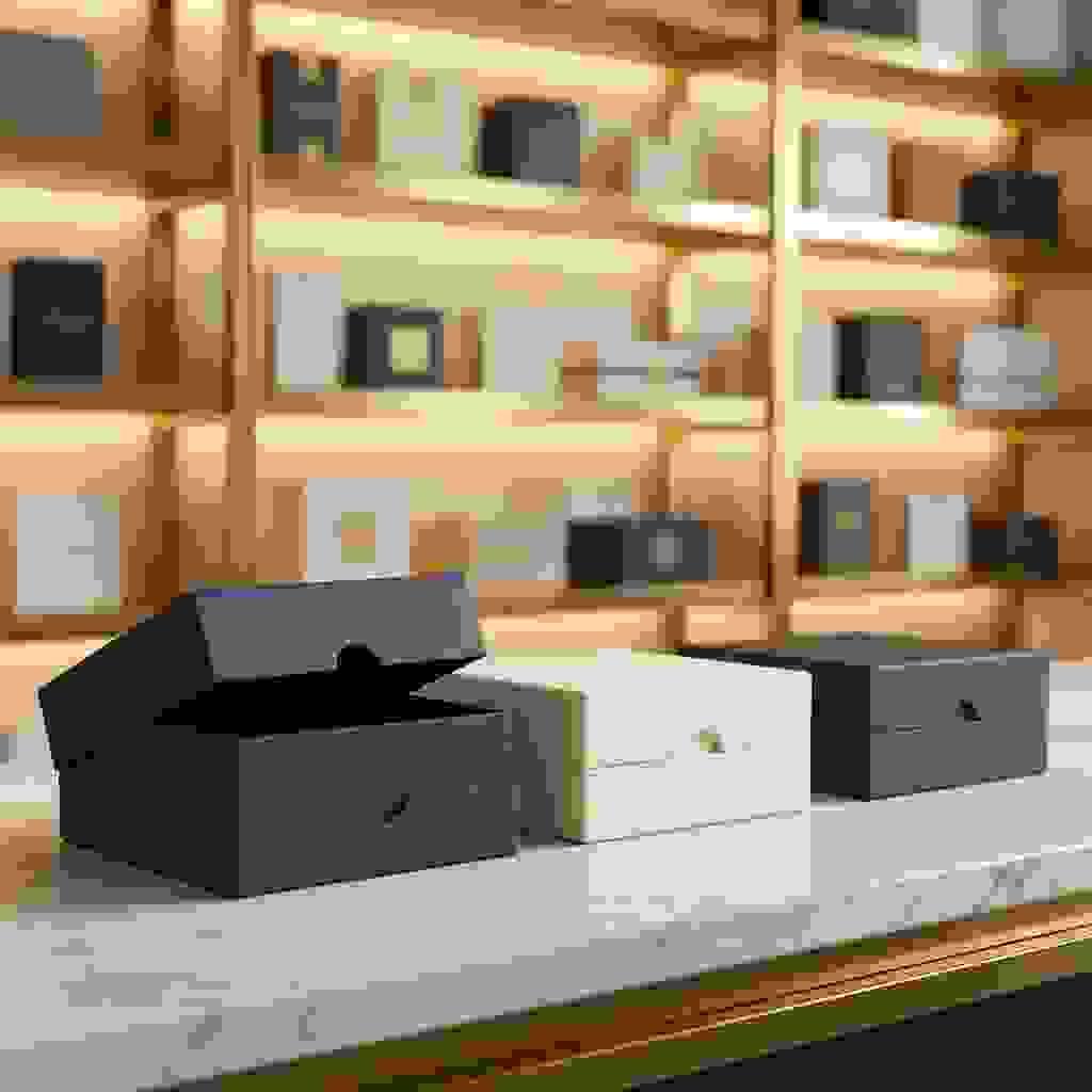 Two-piece lid boxes with a subtle thumb notch for easy opening, shown with one box slightly opened. Two-piece lid boxes with a subtle thumb notch for easy opening, shown with one box slightly opened.