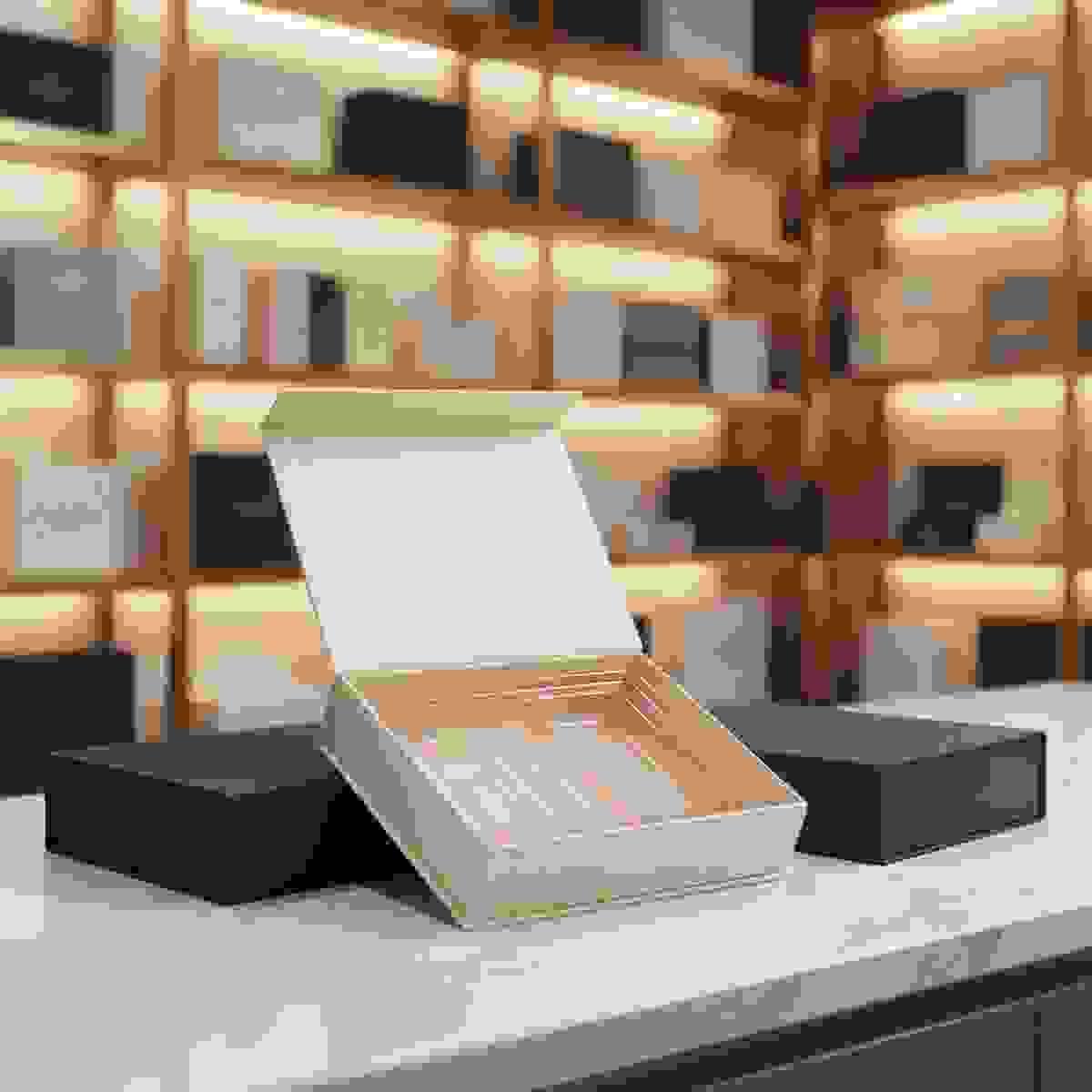 Rigid box with a vacuum formed PET tray insert, shown open to display precise molded cavities. Rigid box with a vacuum formed PET tray insert, shown open to display precise molded cavities.