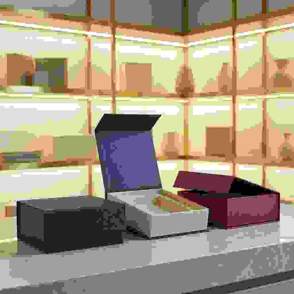 Custom magnetic closure rigid boxes in a premium sample room setting, featuring luxury paper wrap and precise structure Custom magnetic closure rigid boxes in a premium sample room setting, featuring luxury paper wrap and precise structure