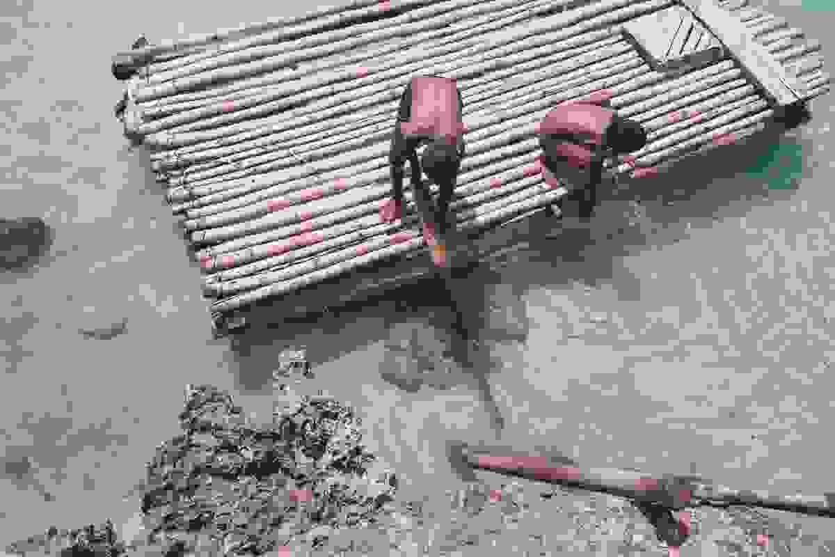 Locals building a raft, Sumba Island, East Nusa Tenggara, Indonesia