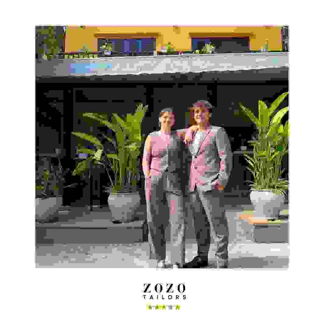 Couple wearing tailoring in the same cashmere fabric with two different styles Couple wearing tailoring in the same cashmere fabric with two different styles