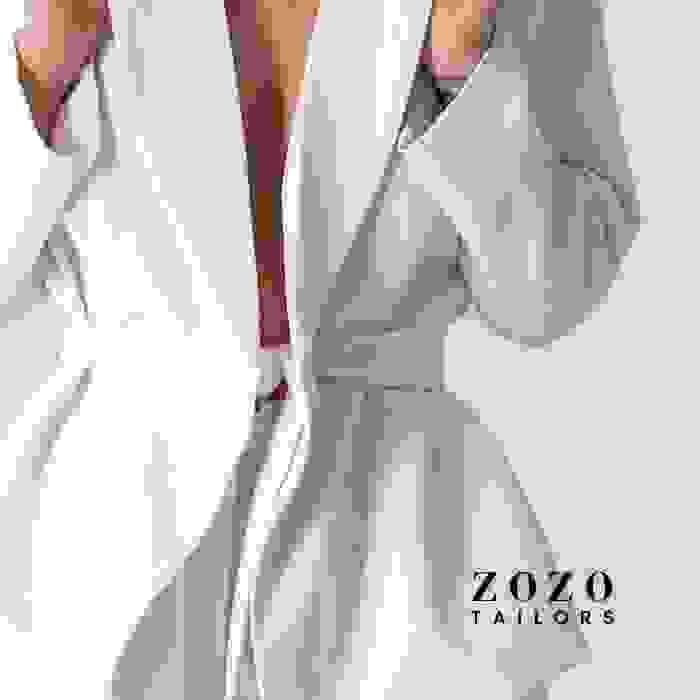 close up of women's contemporary pant suit in winter-white