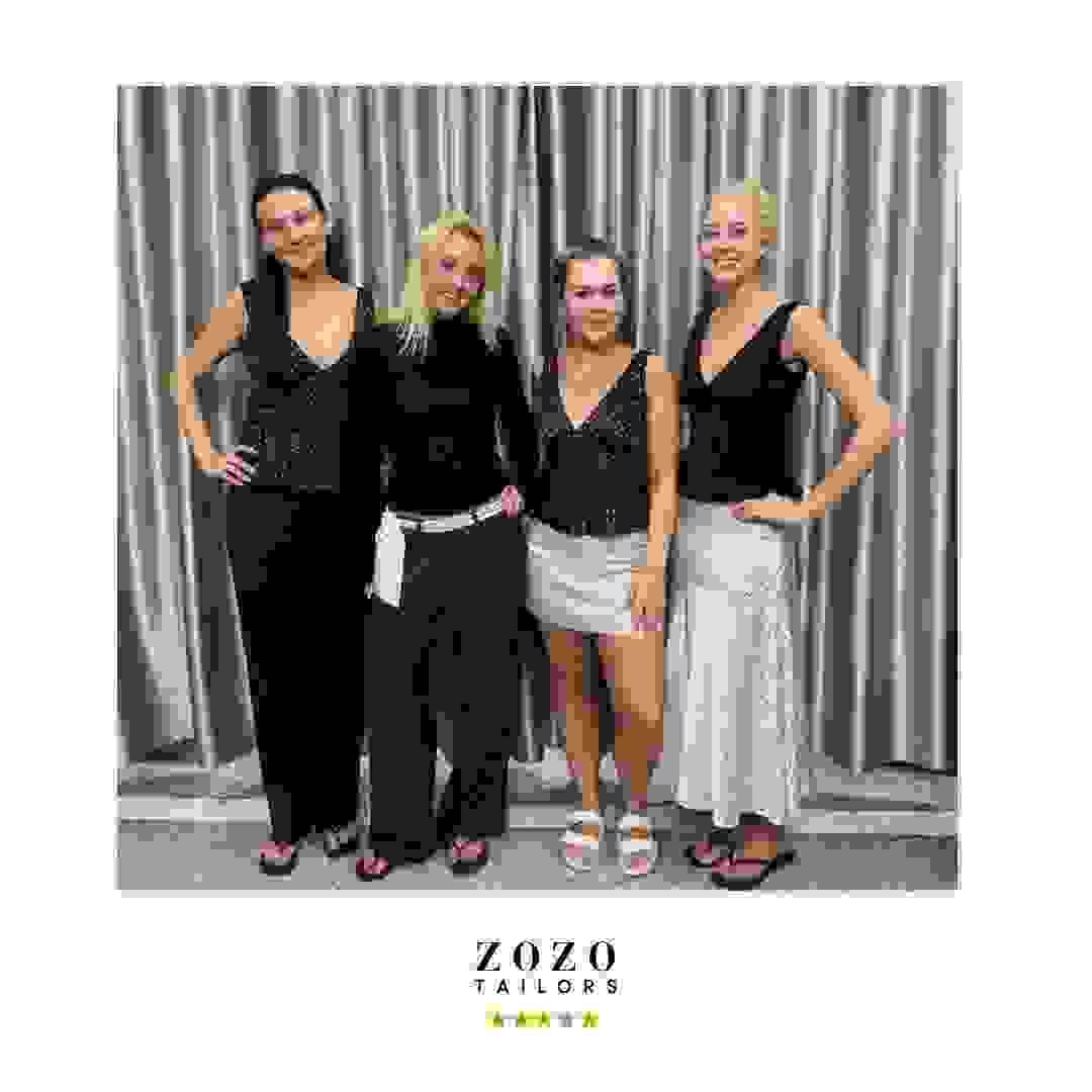 Group wearing coordinated tailored pieces for travel and day-to-evening wear Group wearing coordinated tailored pieces for travel and day-to-evening wear
