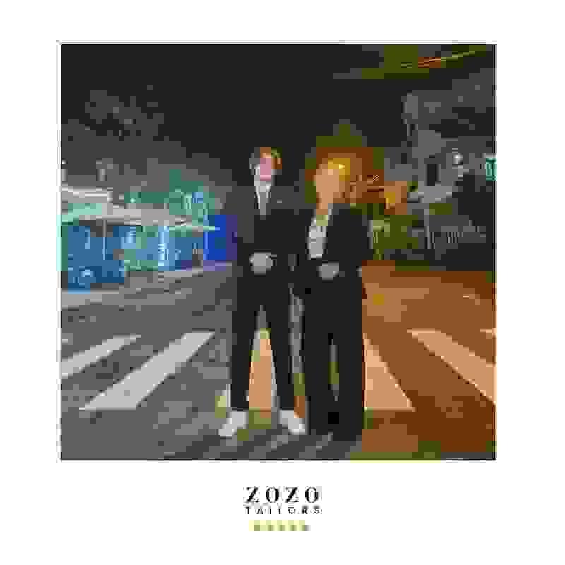 Mother and teen son, each wearing a bespoke suit they commissioned in Hoi An Mother and teen son, each wearing a bespoke suit they commissioned in Hoi An