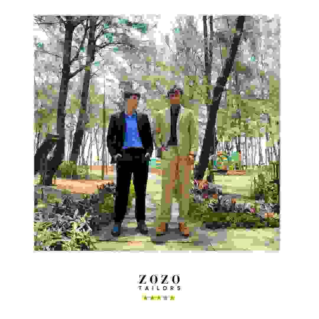 Two young men in a garden setting near tAn Bang beach , Hoi An, wear new suits and shirts, chosen whilst on vacation. Two young men in a garden setting near tAn Bang beach , Hoi An, wear new suits and shirts, chosen whilst on vacation.