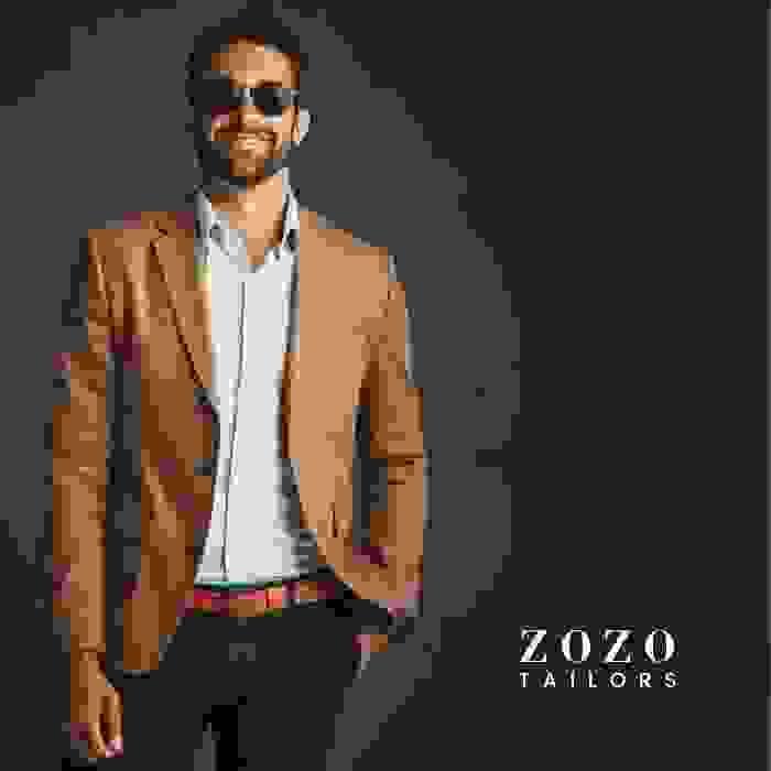 Soft brown linen sports jacket paired with a pale blue shirt — a refined yet relaxed smart casual look.