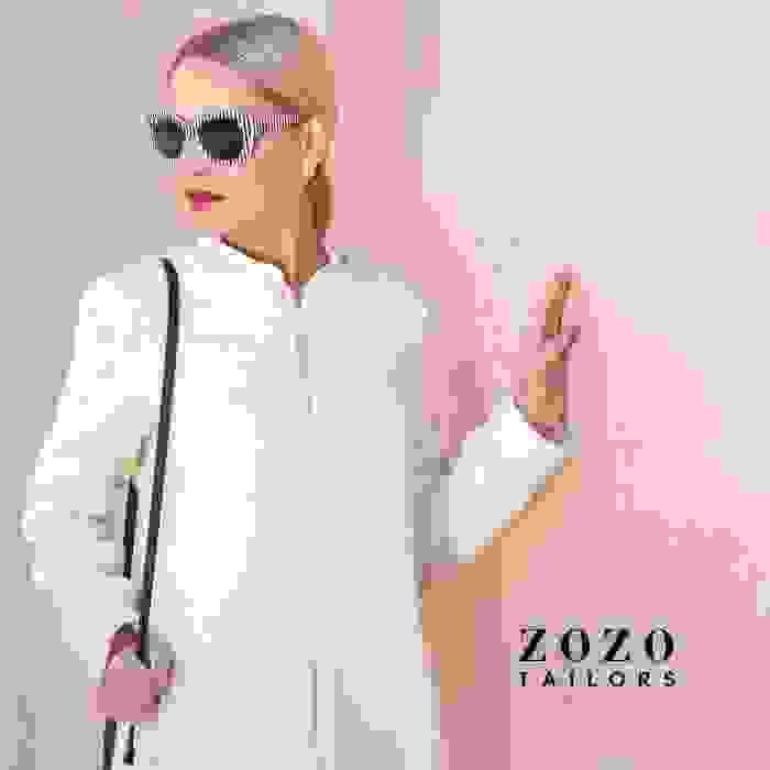 Winter-white tailored coat in pure wool — full-length zip detail adds modern refinement.