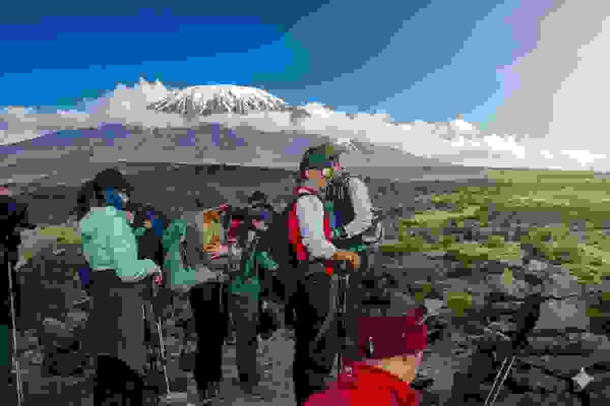 Kilimanjaro trekking scenic view of the mountain and climbers Kilimanjaro trekking scenic view of the mountain and climbers