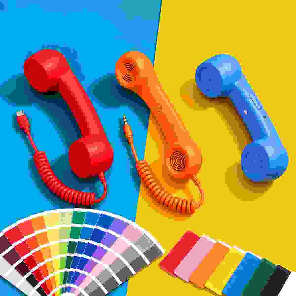 Three retro phone handsets in red, orange and blue with color swatches, showing custom color options for Model 569 USB Type-C, Model 3289 3.5mm and Model 298 Bluetooth handsets. Three retro phone handsets in red, orange and blue with color swatches, showing custom color options for Model 569 USB Type-C, Model 3289 3.5mm and Model 298 Bluetooth handsets.