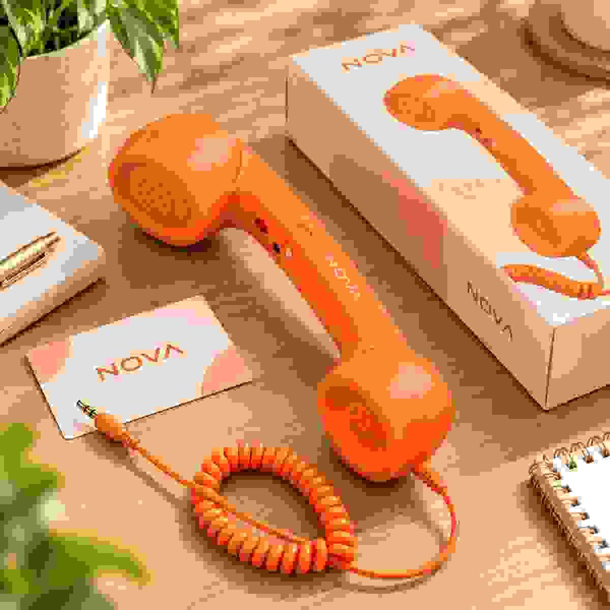 Orange retro phone handset with custom NOVA logo branding, matching retail packaging and brand card for OEM and private-label projects Orange retro phone handset with custom NOVA logo branding, matching retail packaging and brand card for OEM and private-label projects