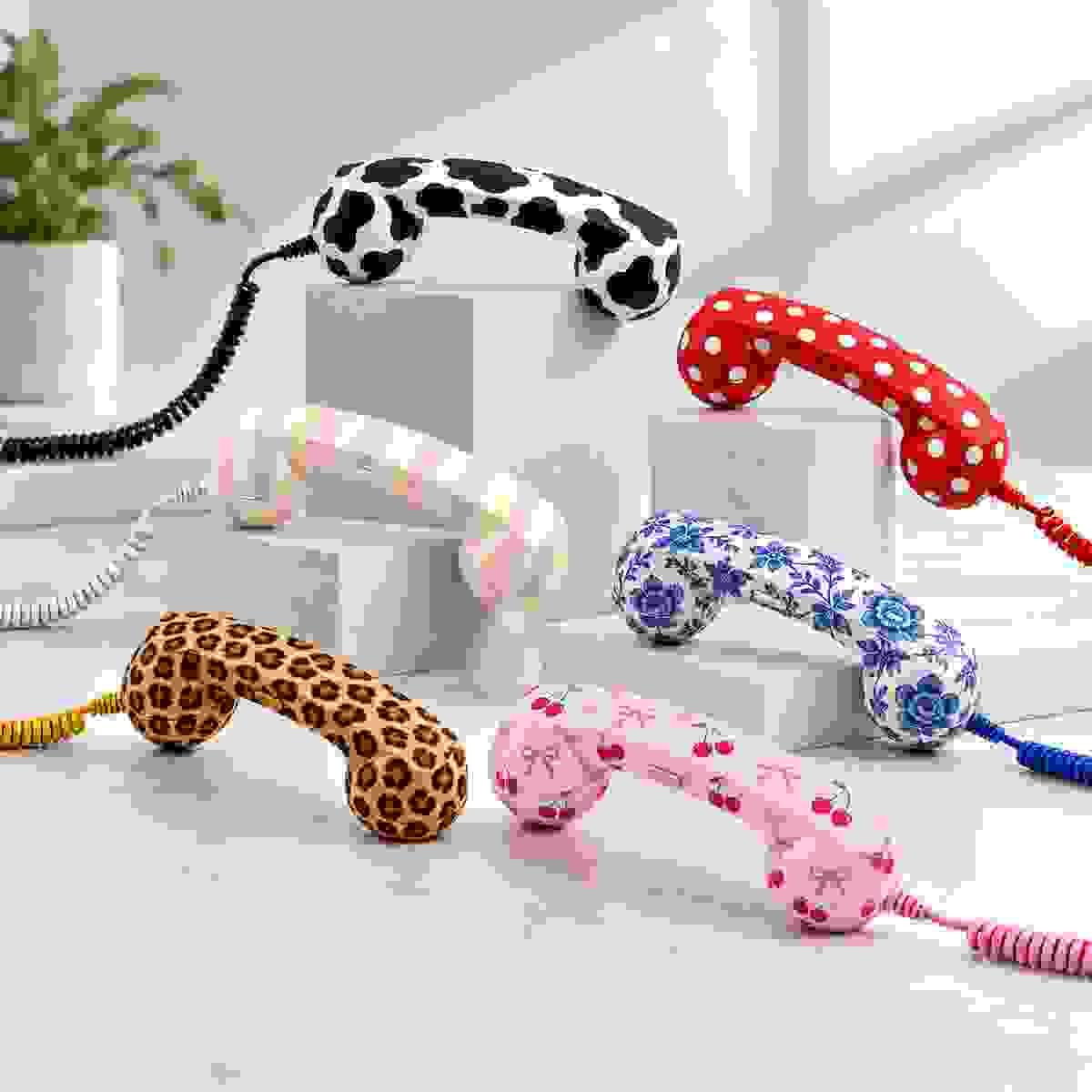 Six retro phone handsets with custom patterns including cow print, polka dots, pastel stripes, blue floral, leopard print and cherry bow designs for OEM and ODM projects Six retro phone handsets with custom patterns including cow print, polka dots, pastel stripes, blue floral, leopard print and cherry bow designs for OEM and ODM projects