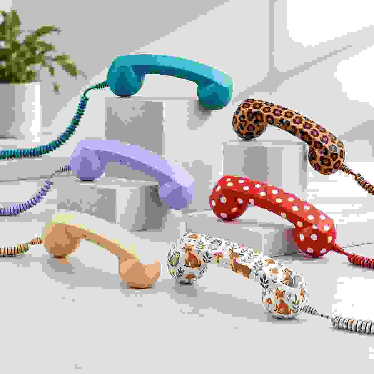 Retro phone handset custom color and pattern options showing six handsets in three solid colors and three patterns, including leopard print, red with white polka dots, and forest animal print Retro phone handset custom color and pattern options showing six handsets in three solid colors and three patterns, including leopard print, red with white polka dots, and forest animal print