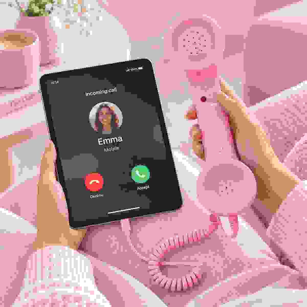 Retro phone handset connected to a tablet for voice calls, online communication and everyday iPad use Retro phone handset connected to a tablet for voice calls, online communication and everyday iPad use