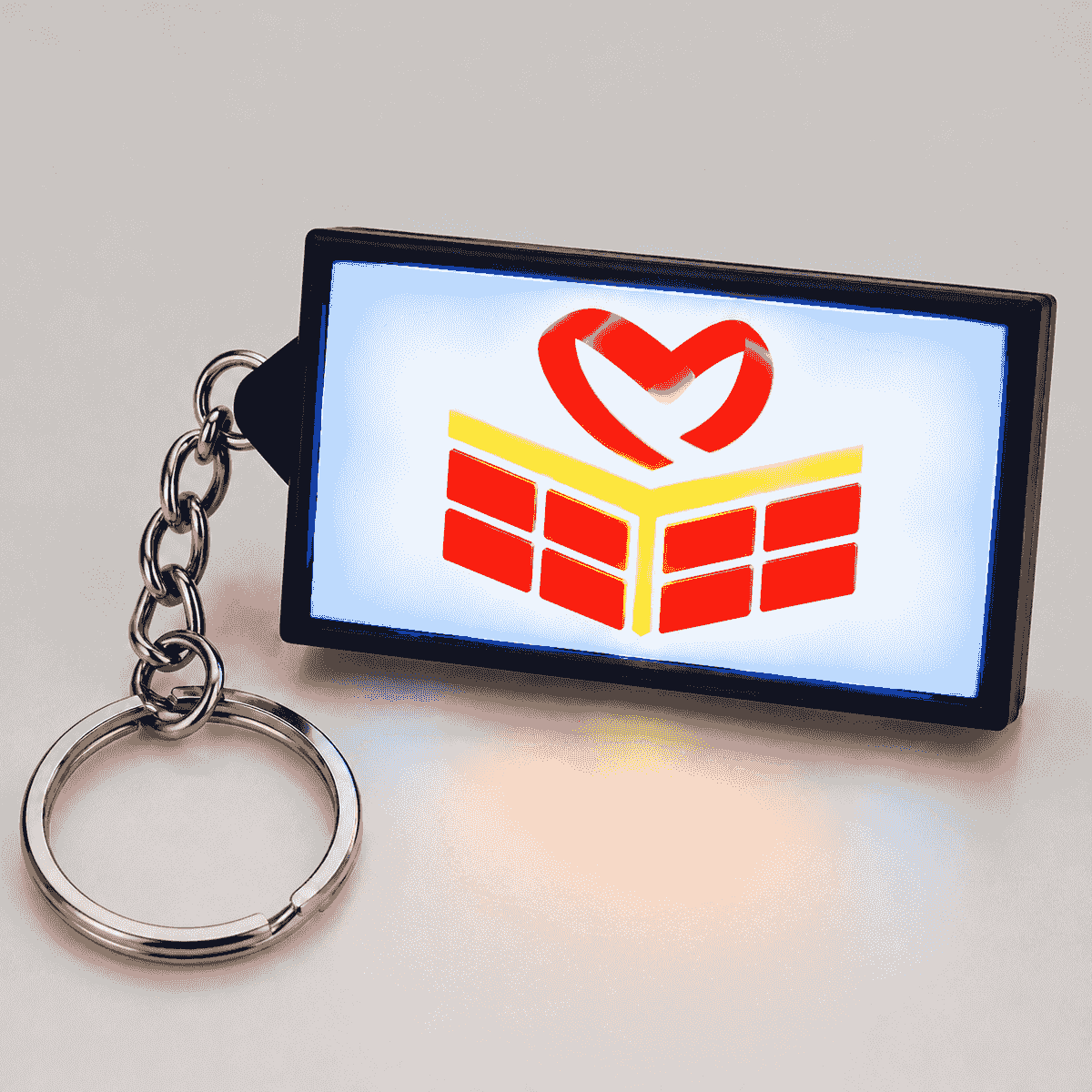 Illuminated LED sign keychain glowing in the dark Illuminated LED sign keychain glowing in the dark