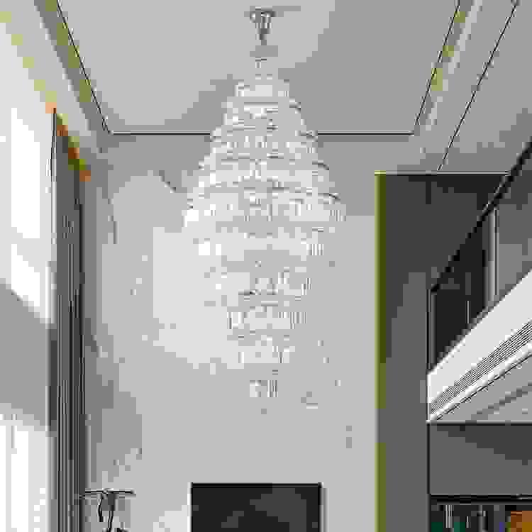 Luxury double-height staircase chandelier with cascading crystals, perfect for open foyer spaces and grand entrances.
