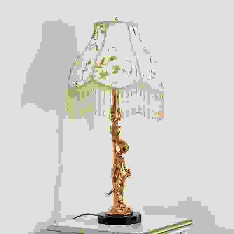 Elegant brass table lamp for girls’ bedroom with classic design and warm lighting