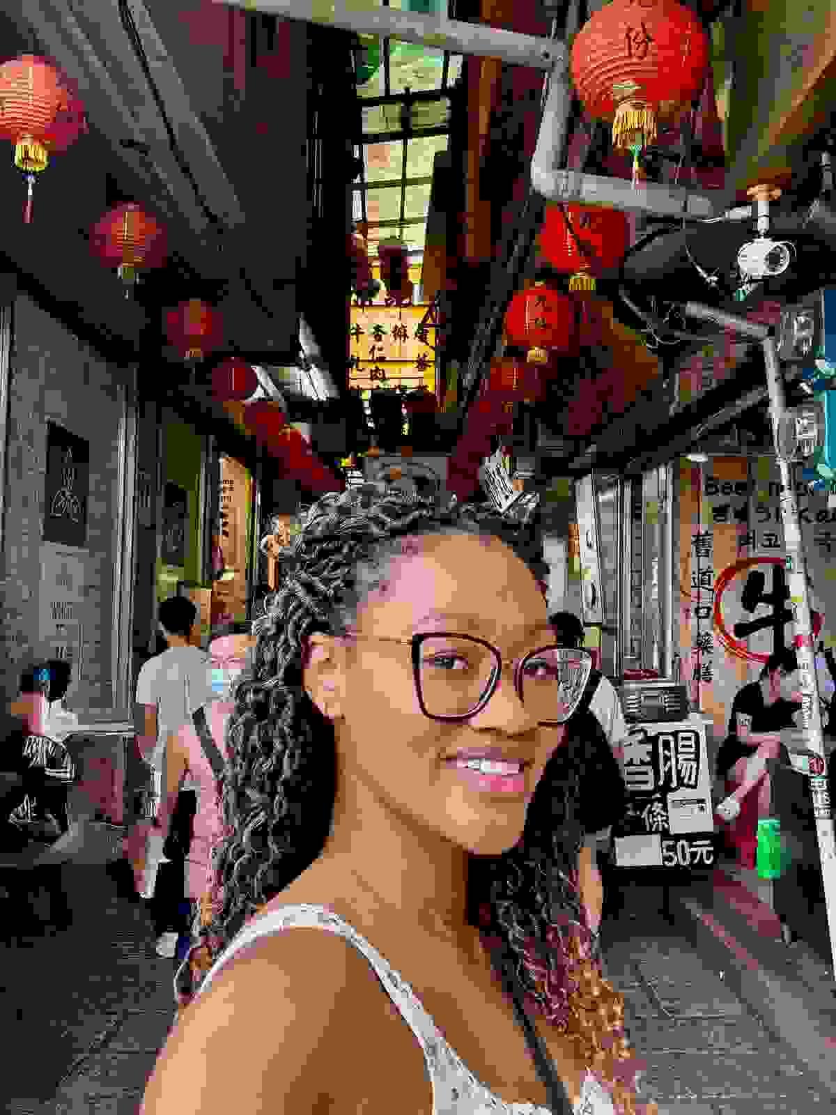 Brit Thompson selfie in the Jiufne Old Street with red lanterns
