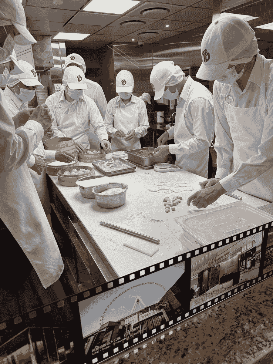 Men hand crafting the soup dumplings in Taipei Taiwan