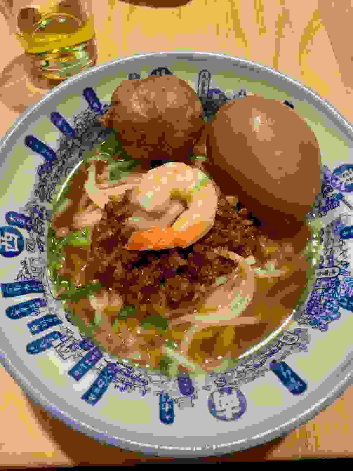Dan Zai Noodles Ta-a noodles or danzai noodles minced pork, prawn, bean sprouts, cilantro, black vinegar, garlic, soy sauce and egg Soup in the Dihau Old Street market