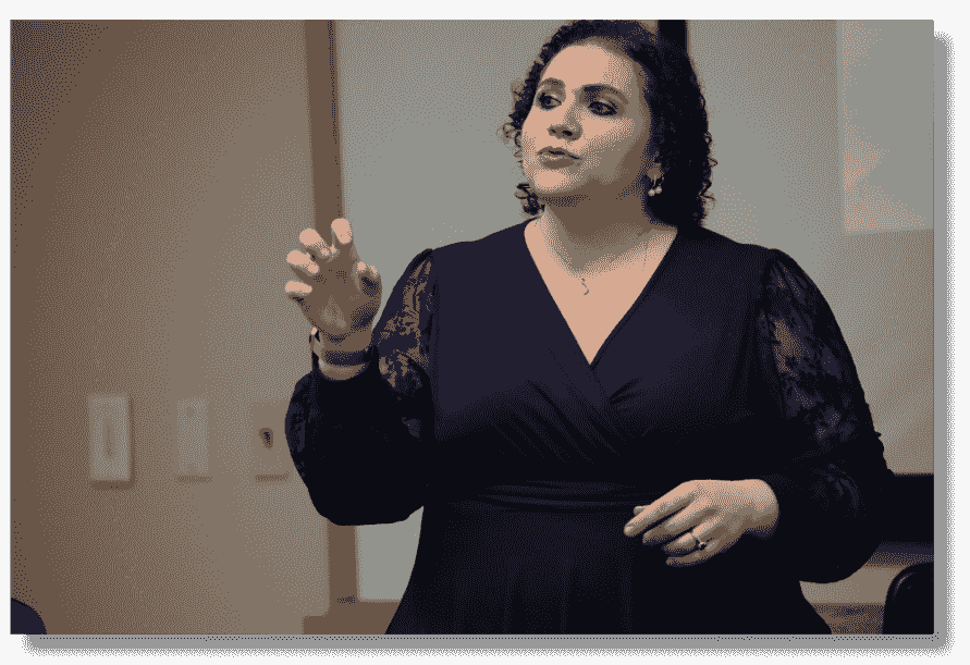 Stephanie Scheller speaking onstage about marketing strategy as a small business fractional CMO Stephanie Scheller speaking onstage about marketing strategy as a small business fractional CMO