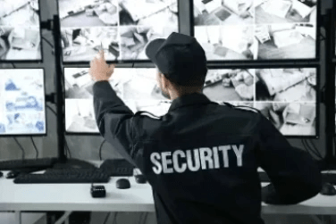 Security Guard monitoring multiple screens  www.gensecwa.com.au