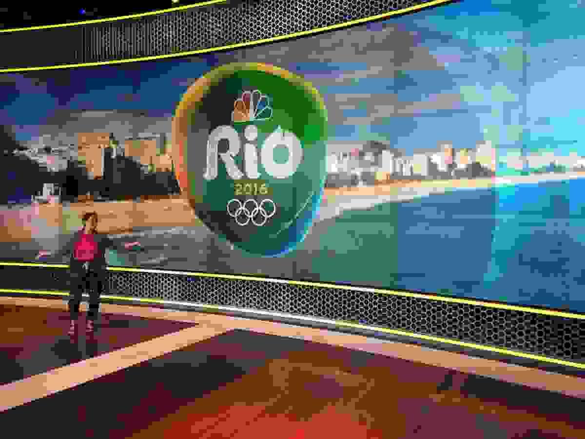 woman in front of Rio Olympics sign woman in front of Rio Olympics sign